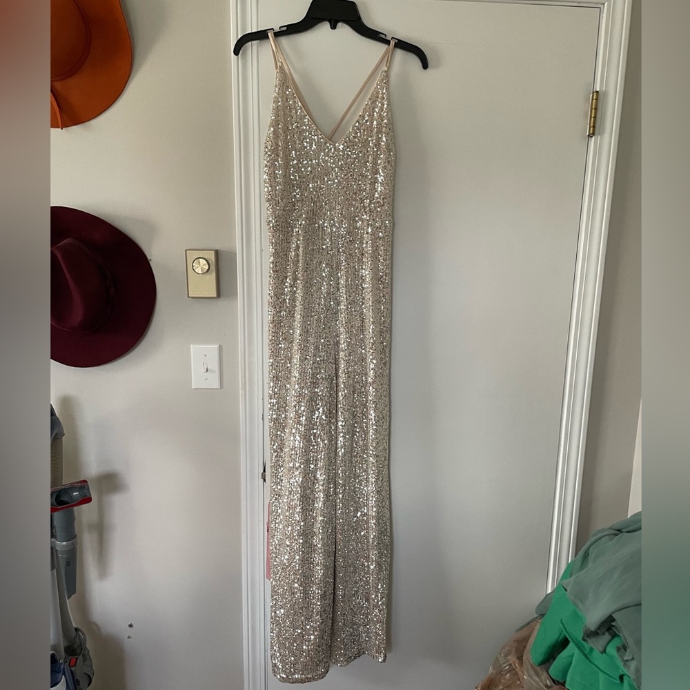 Sequin gold jumpsuit with slit legs and spaghetti strap sleeves